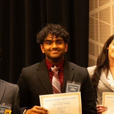 Eshaan Emani receiving the Outstanding Delegate award at PACMUN 2025